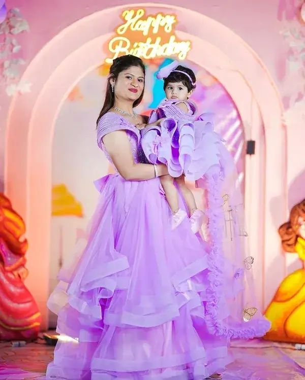 Mother and daughter wearing matching birthday outfits