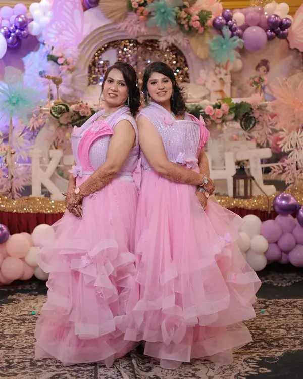 Mother and daughter wearing matching birthday outfits
