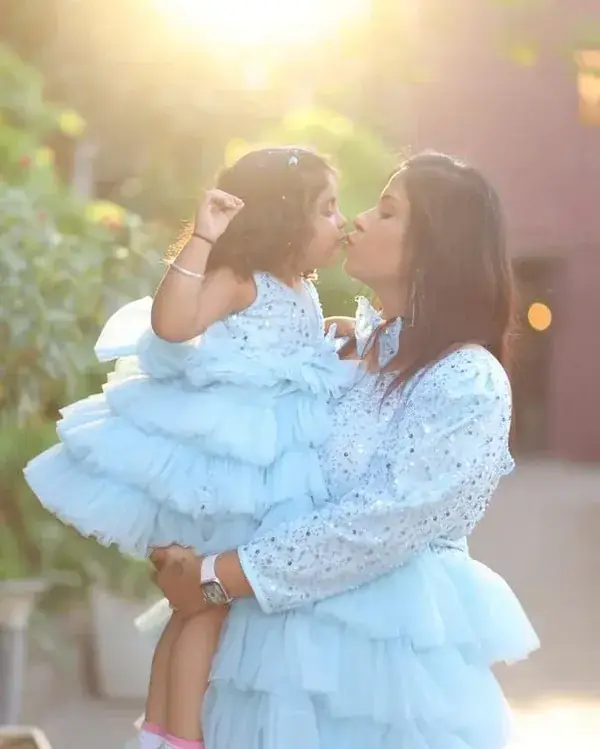 Mother and daughter wearing matching birthday outfits
