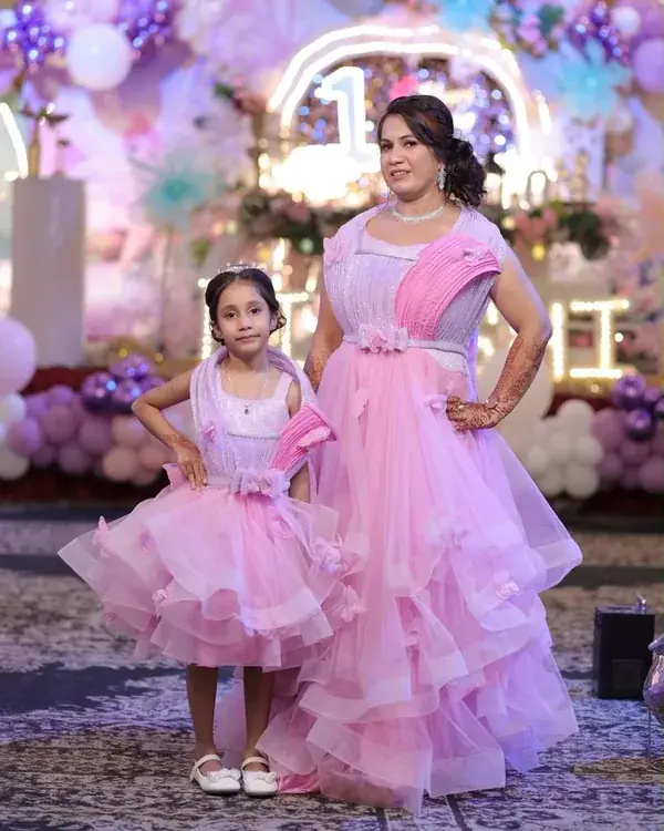 Mother and daughter wearing matching birthday outfits