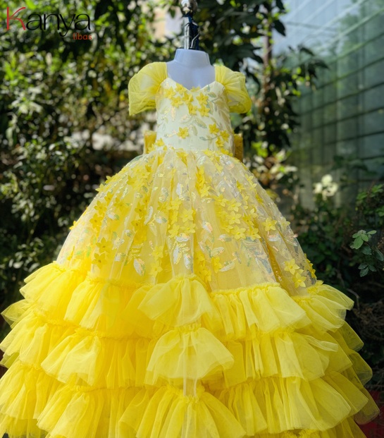 Yellow ball gown with applique flowers